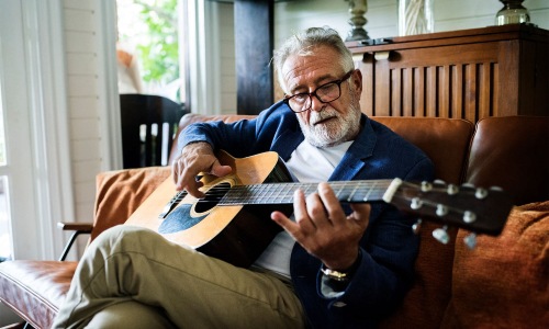 a man playing a guitar