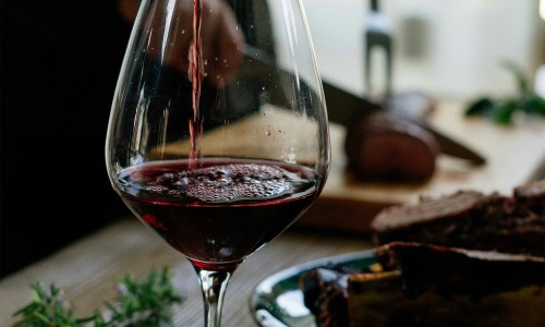 a glass of wine on a table