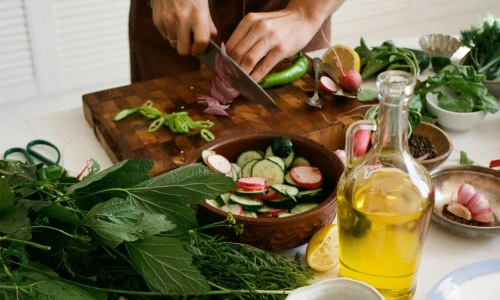 a person cutting vegetables